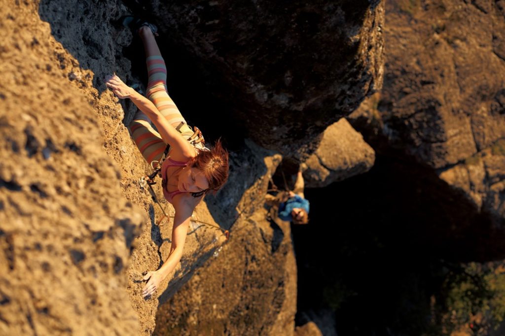 Rachel Hope rock climbing.  Contact Rachel Hope at rachelhopehealing@gmail.com.